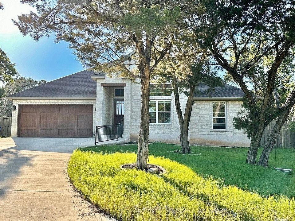 Hill Country home nestled amongst cedars and live oaks.
