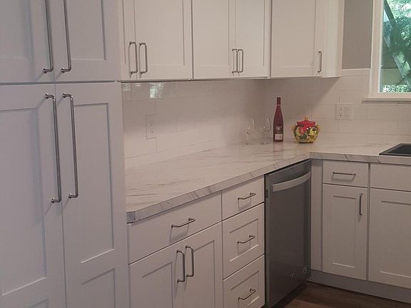 Floor-to-ceiling pantry to the left in your brand new kitchen