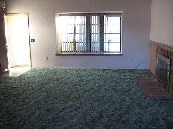 Living rm w/brick fireplace