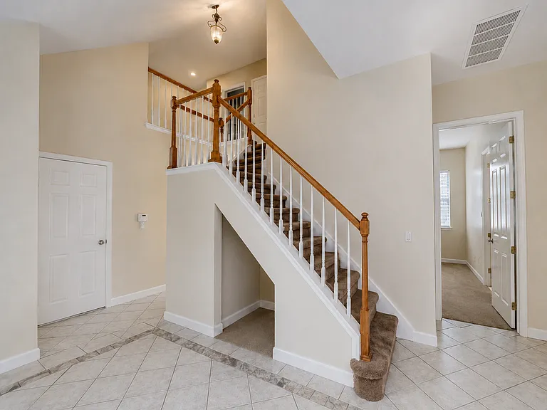 Beautiful Staircase to Upstairs Bonus Room, Half Bath and Large storage Closets