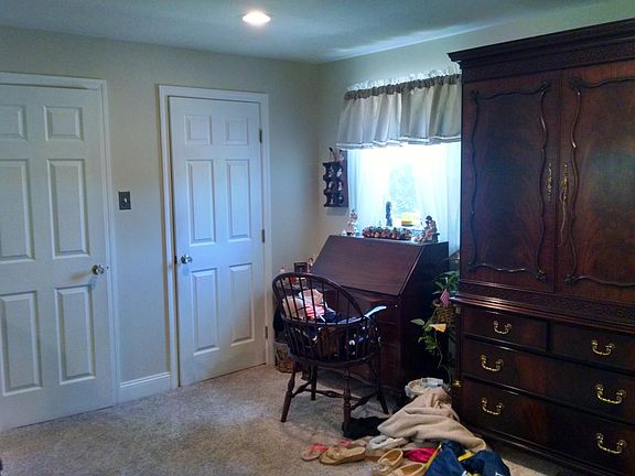 Bedroom showing large walk-In closet doors