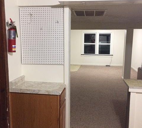 Kitchen opens into large living room.