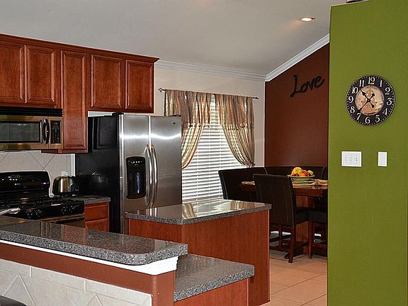 chef's delight kitchen features stainless appliances and upgraded 42" cabinets