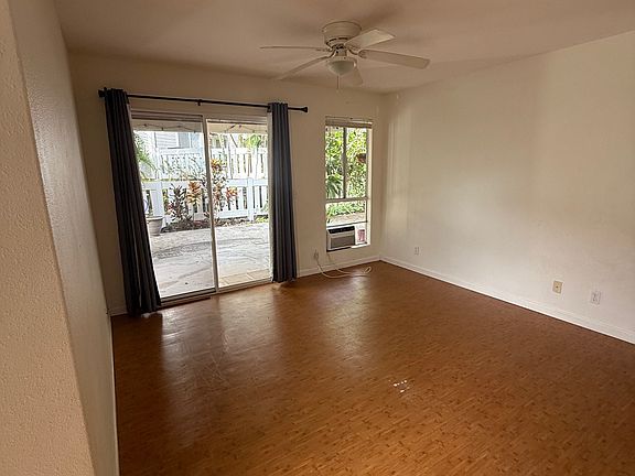 Living room from front door - out to large gated patio area