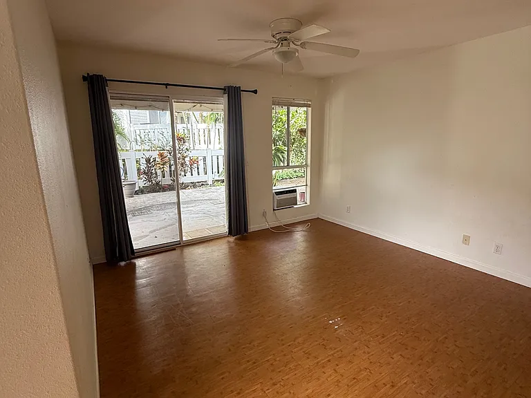 Living room from front door - out to large gated patio area