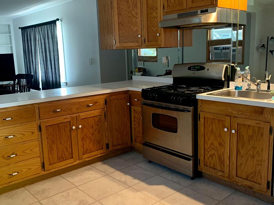 Kitchen with new stove and fridge