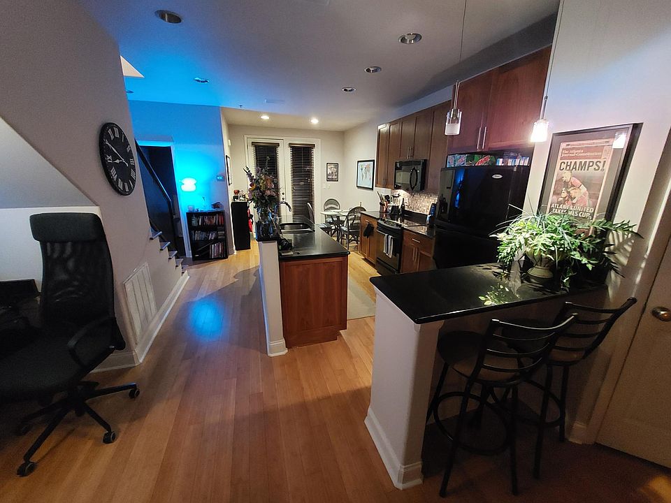 The kitchen and bar, as seen from the front living area.