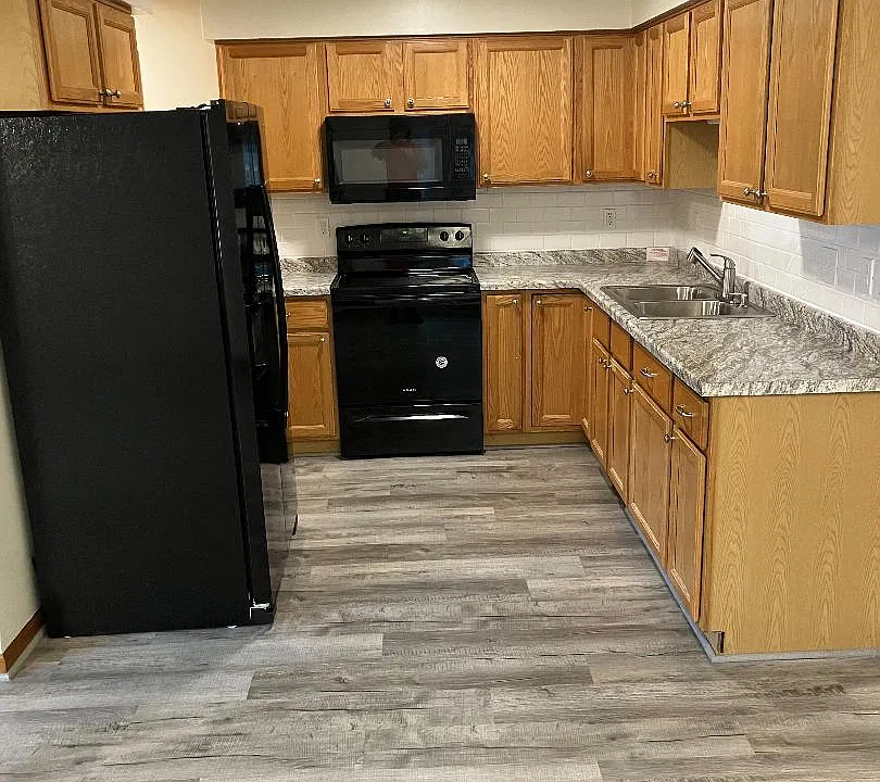 kitchen renovated with new fixtures, countertop, flooring and fresh paint