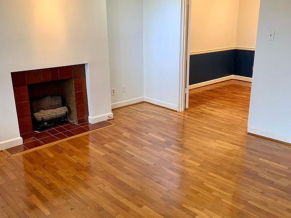 Spacious living room with beautiful hardwood floors