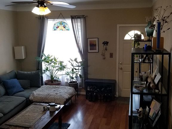 View of living room from staircase. Nice big window facing west.