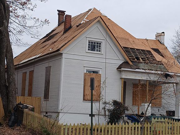 House exterior in December 2025. All new roof, completely rebuilt top to bottom. First move after renovation.