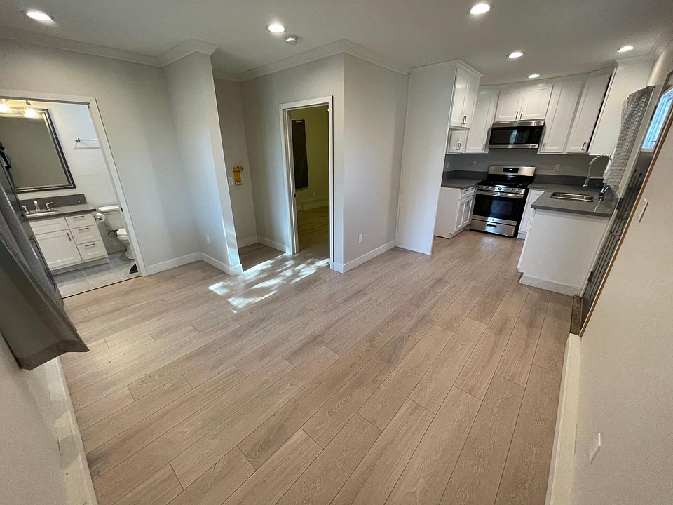 Living space, bathroom, washer/dryer hook ups, bedroom, and kitchen.