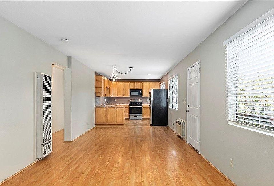 Open and Bright Living Room, Dining Room, and Kitchen