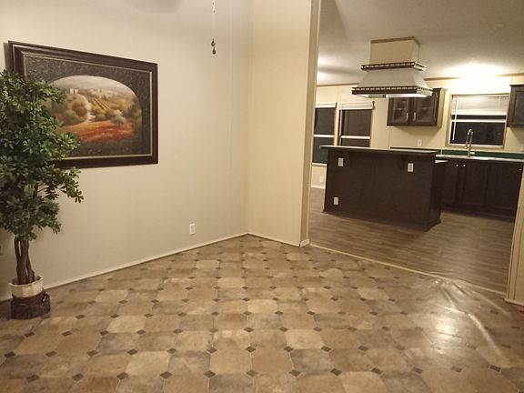 Formal dining room area overlooking the kitchen.