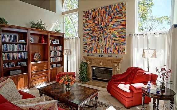 Formal living room with custom travertine tile fireplace