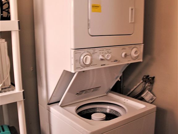 Washer/dryer unit on main floor inside apartment