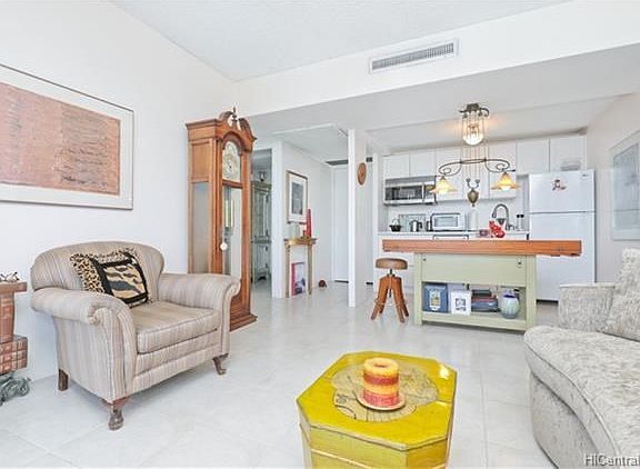 See how open floor plan flows from entry door.