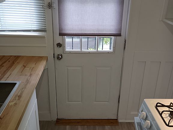 View of kitchen towards rear balcony door