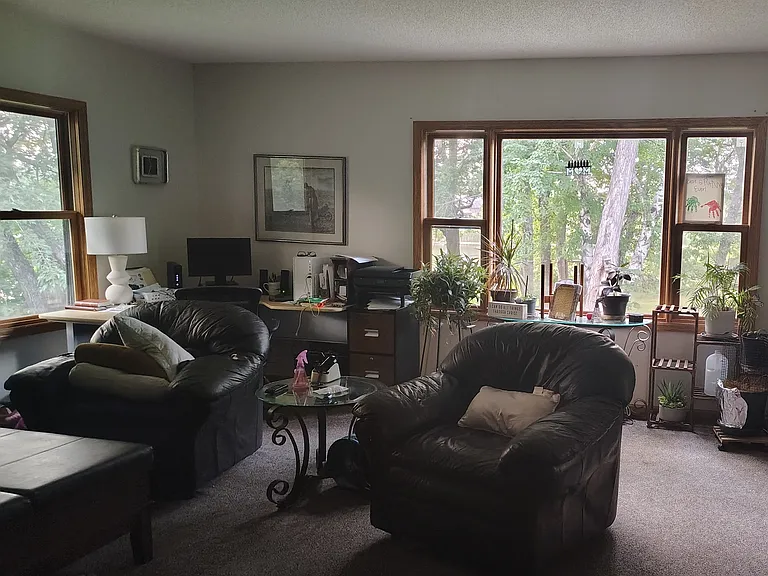 Living room facing the window towards the pond on the North end