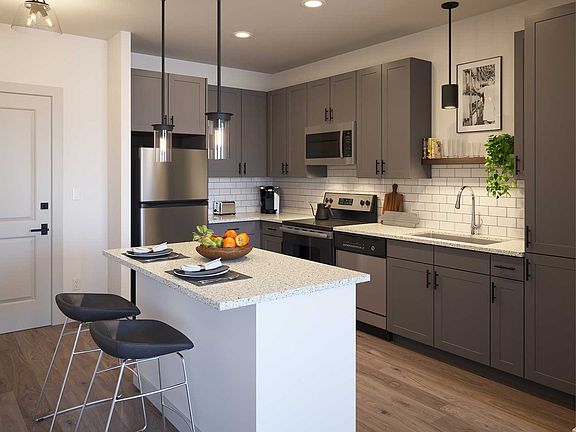 Residences feature modern kitchens with granite countertops and stainless steel appliances. You'll also find an in-unit washer and dryer, as well as individually controlled heating and cooling.