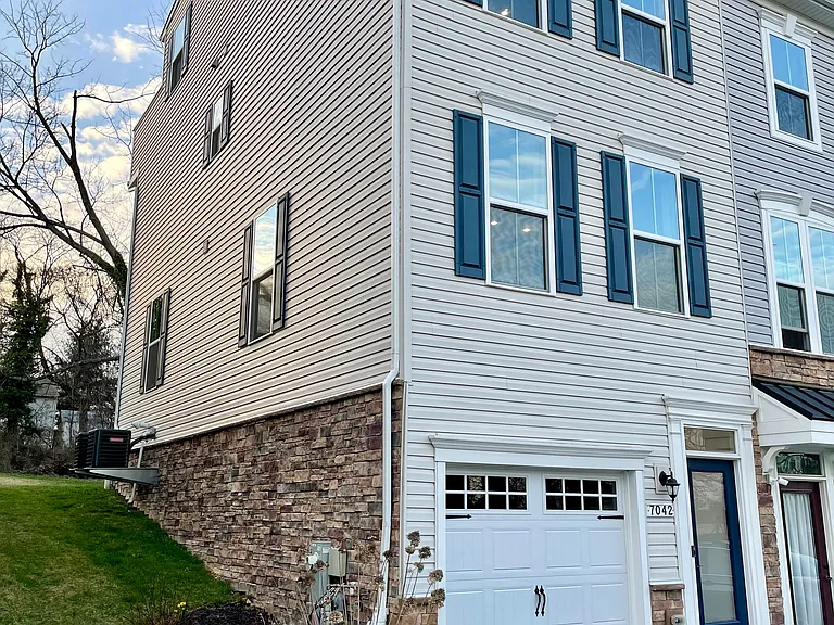 End-unit townhome with blossoming landscaping.
