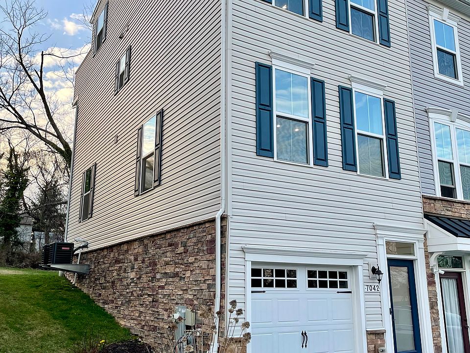 End-unit townhome with blossoming landscaping.