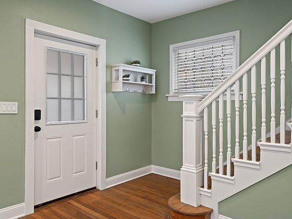 Welcome home!
Front door with digital lock, entryway foyer and staircase