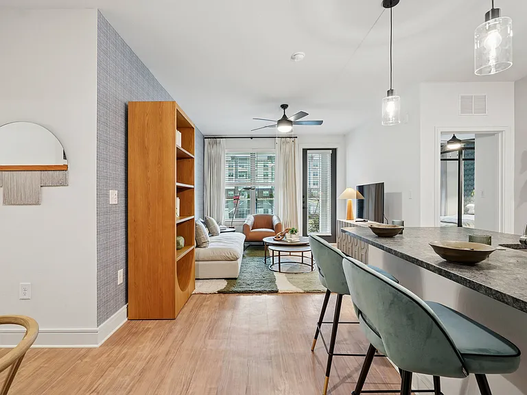 Kitchen Peninsula with Seating Space and View into Living Room