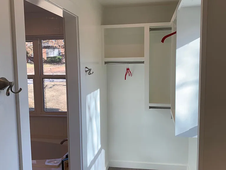 LARGE WALK IN MASTER CLOSET WITH WOOD FLOORS