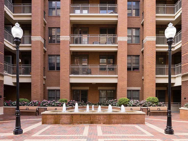 Shaded, landscaped courtyard with fountain.