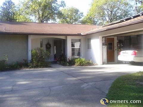 front of house with solar panels on roof