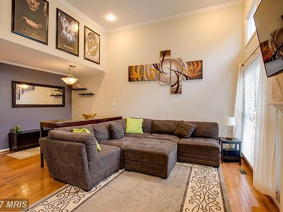 Bright Two-Story Family Room with Fire Place