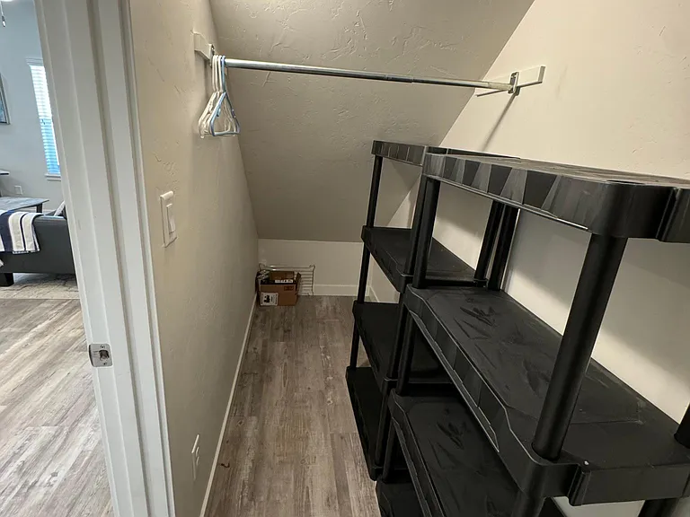 Large closet under stairs.