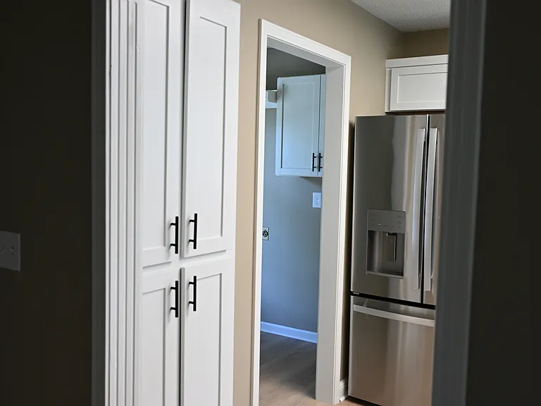 View of kitchen from entry/living room.