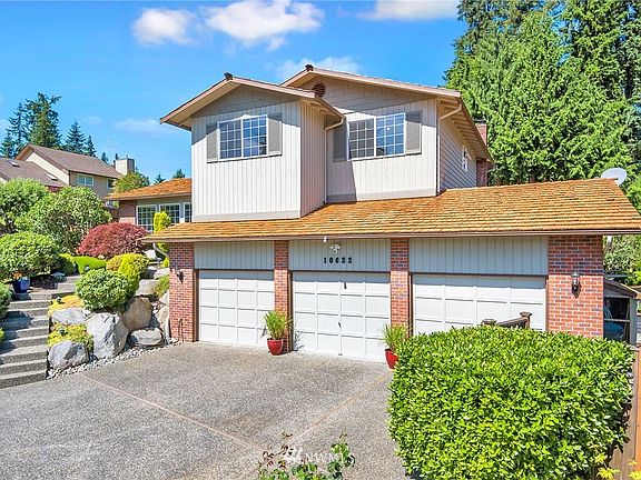 Custom cedar shake roof - Last month this roof was inspected, cleaned, treated and given a 5-year certification on its durability. Vendor said, "this roof could last another 15 - 20 years with minimal yearly maintenance".