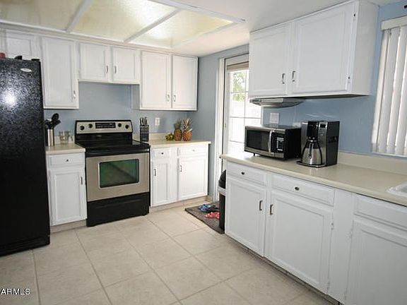 Tiled Kitchen & White Cabinets