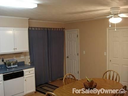 Kitchen. Doors from left to right: back deck, pantry, and laundry.