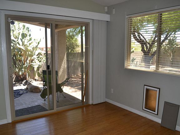 Doggy door with lockable insert for security. Dog not included with house :)