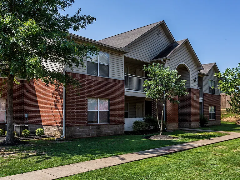 Explore the charming exterior of this contemporary apartment, offering a harmonious blend of style and nature.