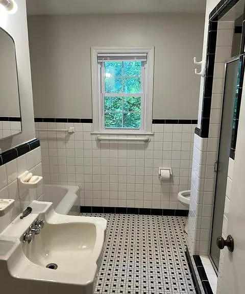 Bathroom with tub and shower