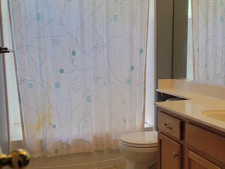 Downstairs bathroom has 2 doors, one into bedroom, the other opens to foyer - can use as a private or guest bathroom as you see fit