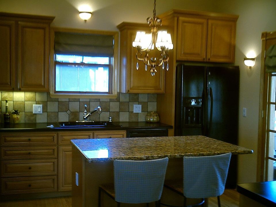 The eat-in island is topped with granite.  