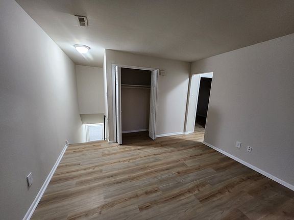 Storage closet at top of entrance stairs.