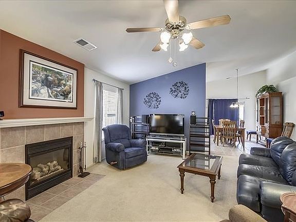 Enjoy cozy evenings in front of the gas log fireplace featured in the living room.