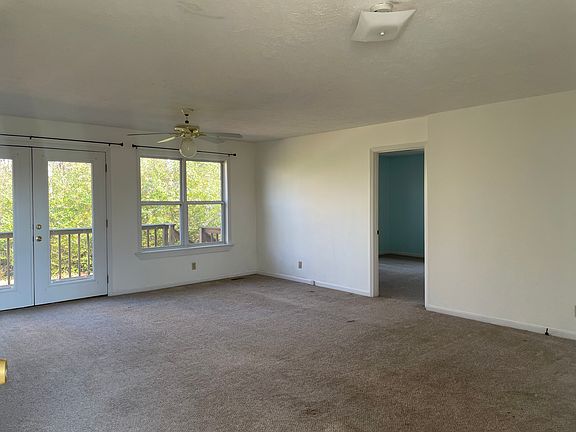 Living room/dinning room area with back porch
