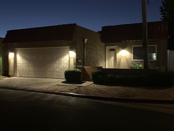 FRONT OF HOUSE (Night View) - Upgraded LED night-sensored driveway, porch lighting fixtures and automatic garage door open/close system installed to enhance privacy and security.