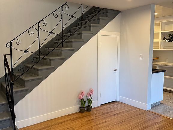 4423 Living area with stairwell to bedroom/ bathroom upstairs