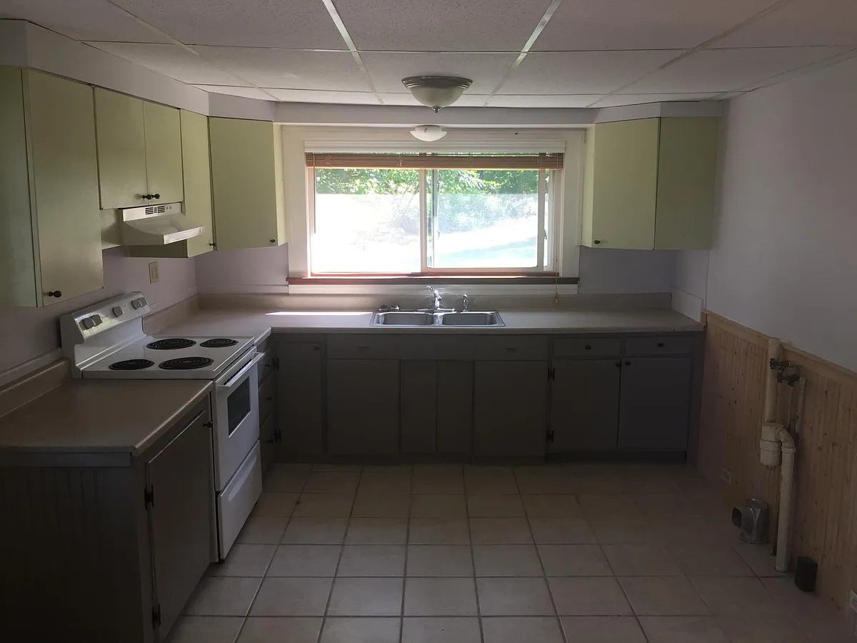 kitchen. The refrigerator isn't shown here but it is located on the left wall beside the washer/dryer hook up - Old Brunswick Rd