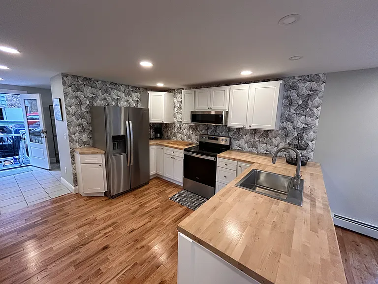 View of kitchen looking into mud room.