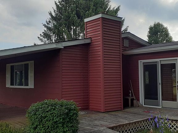 Side of home and outside door to sunporch